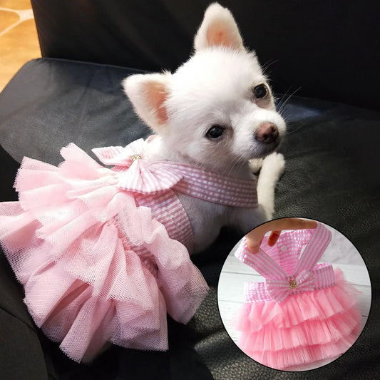 Puppy wearing Pink and white stripe with bow and pink tulle dress for pets