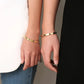 Tier Bezel Bangle in Gold on model wrist