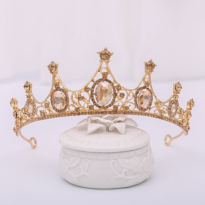 Our Champagne Crown offers a regal look suitable for any special occasion or simply for enjoying a regal grandeur in the comfort of one's own home. It is crafted from alloy and rhinestones and imported for quality assurance.